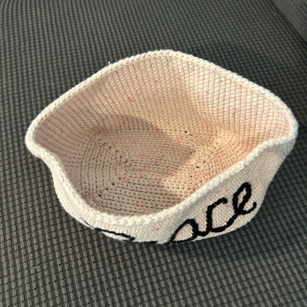 Cream organizer with the word peace